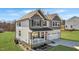 Two-story home with front porch and two-car garage, set in a nicely landscaped yard at 1318 Reading Ct, Burlington, NC 27217