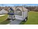 A two-story home featuring a charming front porch and a two-car garage at 1318 Reading Ct, Burlington, NC 27217