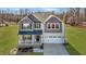 Beautiful home featuring a front porch, a well-manicured lawn and a two-car garage at 1318 Reading Ct, Burlington, NC 27217