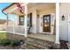Inviting front porch with rocking chairs and views at 1318 Reading Ct, Burlington, NC 27217