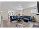 Expansive living area with open layout, blending kitchen and living spaces, featuring large sectional sofa at 1318 Reading Ct, Burlington, NC 27217