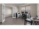 Well-lit office space with hardwood flooring, large windows, and functional setup perfect for productivity at 1318 Reading Ct, Burlington, NC 27217