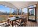 Screened porch with wood-framed windows and a dining table set at 1318 Reading Ct, Burlington, NC 27217