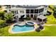 Aerial view of pool, outdoor kitchen and backyard of this stunning estate at 1416 Barony Lake Way, Raleigh, NC 27614