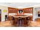 Well-equipped bar featuring seating for four, custom cabinets, and modern amenities at 1416 Barony Lake Way, Raleigh, NC 27614