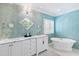 Bright bathroom features dual sink vanity, soaking tub, and natural light from window at 1416 Barony Lake Way, Raleigh, NC 27614