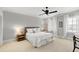 Bright bedroom featuring a ceiling fan, neutral tones, and natural light, creating a relaxing and inviting atmosphere at 1416 Barony Lake Way, Raleigh, NC 27614