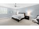 Inviting bedroom with soft blue walls, a ceiling fan, and natural light creating a serene and cozy retreat at 1416 Barony Lake Way, Raleigh, NC 27614