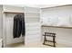 Spacious walk-in closet with custom shelving and hanging rods providing ample storage space at 1416 Barony Lake Way, Raleigh, NC 27614