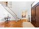 Elegant foyer features a grand staircase, hardwood floors, and a view to other rooms at 1416 Barony Lake Way, Raleigh, NC 27614