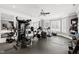 Spacious home gym featuring mirrored walls, rubber flooring, and plenty of equipment at 1416 Barony Lake Way, Raleigh, NC 27614