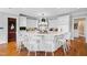 Spacious kitchen showcases a large island with seating, white cabinets, and hardwood flooring at 1416 Barony Lake Way, Raleigh, NC 27614