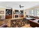 Spacious living room featuring a fireplace, built-in bookshelves, and ample seating at 1416 Barony Lake Way, Raleigh, NC 27614