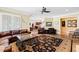 Comfortable living room with plush seating, shutters, and view to bar area at 1416 Barony Lake Way, Raleigh, NC 27614