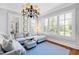 Comfortable living room with a cozy sectional sofa, natural light, and hardwood flooring at 1416 Barony Lake Way, Raleigh, NC 27614