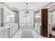 Luxurious main bathroom with marble floors, soaking tub, and double vanities at 1416 Barony Lake Way, Raleigh, NC 27614