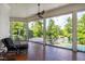 Inviting screened porch with wood flooring overlooks the pool and backyard at 1416 Barony Lake Way, Raleigh, NC 27614