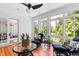 Cozy sunroom featuring wicker furniture, brick accents, and an abundance of natural light at 1416 Barony Lake Way, Raleigh, NC 27614