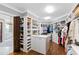 Expansive walk-in closet featuring custom shelving and an abundance of storage space at 1416 Barony Lake Way, Raleigh, NC 27614