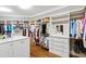 Large walk-in closet with custom shelving, drawers, and organized storage spaces at 1416 Barony Lake Way, Raleigh, NC 27614