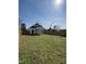 Sprawling backyard with new fencing surrounding the perimeter of the property at 151 E Washington St, Coats, NC 27521