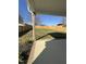A large, fenced backyard with a covered porch area and plenty of room to enjoy the outdoors at 151 E Washington St, Coats, NC 27521