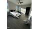 Bedroom with hardwood floors, ceiling fan and two large windows with great natural light at 151 E Washington St, Coats, NC 27521