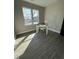 Bright bedroom with large windows, hardwood floors, and a neutral color scheme at 151 E Washington St, Coats, NC 27521