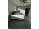 Bedroom with hardwood floors, ceiling fan and two large windows with great natural light at 151 E Washington St, Coats, NC 27521