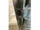 View into another room through a black, panelled door, with wood-look floors at 151 E Washington St, Coats, NC 27521