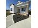 This new build boasts a covered porch, black framed windows, and sidewalk to driveway at 151 E Washington St, Coats, NC 27521
