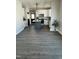 Kitchen with stainless steel appliances, a gray island, and ample cabinet space at 151 E Washington St, Coats, NC 27521