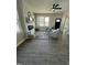 Living Room features hardwood floors, a fireplace, and views of the backyard at 151 E Washington St, Coats, NC 27521