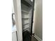 Bathroom storage closet with white shelves, perfect for holding toiletries and other essentials at 151 E Washington St, Coats, NC 27521