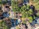Aerial view of townhomes with mature trees and ample parking at 171 Springberry Ln, Chapel Hill, NC 27517