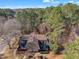 Aerial view of a neighborhood showing a home surrounded by trees with rooftop patio at 171 Springberry Ln, Chapel Hill, NC 27517