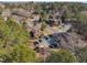 Overhead view of a neighborhood showing homes surrounded by trees and parked cars at 171 Springberry Ln, Chapel Hill, NC 27517