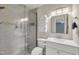 Modern bathroom with a glass-enclosed shower, neutral tile, and updated fixtures at 171 Springberry Ln, Chapel Hill, NC 27517
