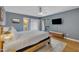 A king-size bed in a primary bedroom and a door leading to the outside at 171 Springberry Ln, Chapel Hill, NC 27517