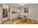 Inviting dining area featuring a stylish table and six modern chairs on wood flooring at 171 Springberry Ln, Chapel Hill, NC 27517