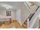 Open concept dining room with stylish chairs, hardwood floors, and access to the stairway at 171 Springberry Ln, Chapel Hill, NC 27517