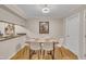 Bright dining room with seating for six and a view into the kitchen area at 171 Springberry Ln, Chapel Hill, NC 27517