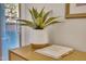 Home entryway featuring a decorative plant, a guest book, and a stylish wooden table at 171 Springberry Ln, Chapel Hill, NC 27517