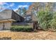 Exterior view of home with a well-kept yard, private fencing and balconies at 171 Springberry Ln, Chapel Hill, NC 27517