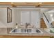 Close up of the kitchen sink opening to a view of the dining room and staircase at 171 Springberry Ln, Chapel Hill, NC 27517
