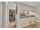 Open kitchen view with stainless steel appliances, wood cabinets, and granite countertops at 171 Springberry Ln, Chapel Hill, NC 27517