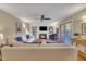 Bright living room with hardwood floors, a fireplace, built-in bookshelves, and comfortable seating at 171 Springberry Ln, Chapel Hill, NC 27517