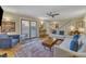 Inviting living room with hardwood floors, a sliding glass door, and comfortable seating at 171 Springberry Ln, Chapel Hill, NC 27517