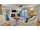 Inviting living room featuring a fireplace, built-in bookshelves, and access to an outdoor area at 171 Springberry Ln, Chapel Hill, NC 27517