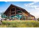 A beautiful community center is shown with expansive views and a stone fireplace at 173 Big Bradley Dr, Wendell, NC 27591